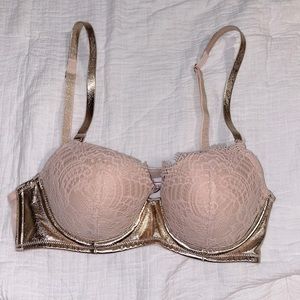 Nude, and gold, lace Victoria’s Secret Demi bra.